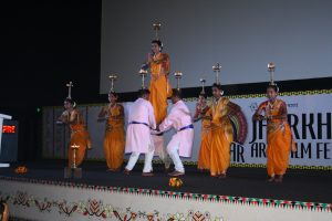 LIGHT IT UP: Men and women perform a graceful, intricate lamp dance