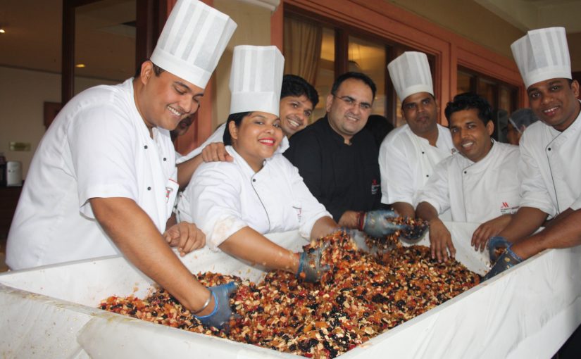 Cake mixing with staff at Goa Marriott Resort